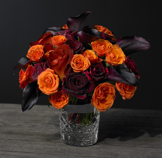 Exotic flowers in a Waterford Crystal tumbler.